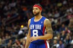 NEWARK, NJ - FEBRUARY 11:  Deron Williams #8 of the New Jersey Nets looks on in the first half against the San Antonio Spurs at Prudential Center on February 11, 2012 in Newark, New Jersey.  NOTE TO USER: User expressly acknowledges and agrees that, by downloading and or using this photograph, User is consenting to the terms and conditions of the Getty Images License Agreement.  (Photo by Chris Chambers/Getty Images)