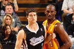 SACRAMENTO, CA - DECEMBER 26:  Jimmer Fredette #7 of the Sacramento Kings posts up against Kobe Bryant #24 Los Angeles Lakers at Power Balance Pavilion on December 26, 2011 in Sacramento, California.  NOTE TO USER: User expressly acknowledges and agrees that, by downloading and or using this photograph, User is consenting to the terms and conditions of the Getty Images License Agreement.  (Photo by Ezra Shaw/Getty Images)