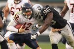 OAKLAND, CA - NOVEMBER 27:  Caleb Hanie #12 of the Chicago Bears is hit by Kamerion Wimbley #96 of the Oakland Raiders at O.co Coliseum on November 27, 2011 in Oakland, California.  (Photo by Ezra Shaw/Getty Images)