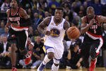 OAKLAND, CA - FEBRUARY 15:  Nate Robinson #2 of the Golden State Warriors dribbles down court in front of Raymond Felton #5 and Gerald Wallace #3 of the Portland Trail Blazers at Oracle Arena on February 15, 2012 in Oakland, California. NOTE TO USER: User expressly acknowledges and agrees that, by downloading and or using this photograph, User is consenting to the terms and conditions of the Getty Images License Agreement.  (Photo by Ezra Shaw/Getty Images)
