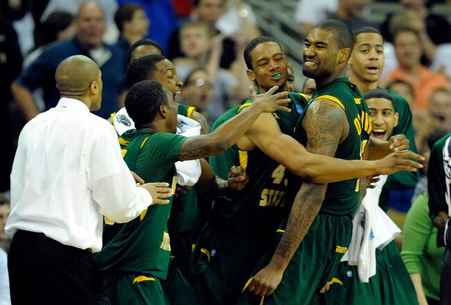 OMAHA, NE - MARCH 16:  Kyle O'Quinn #10 (R) of the Norfolk State Spartans celebrates with his teammates on the bench late in the second half against the Missouri Tigers during the second round of the 2012 NCAA Men's Basketball Tournament at CenturyLink Center on March 16, 2012 in Omaha, Nebraska.  (Photo by Eric Francis/Getty Images)