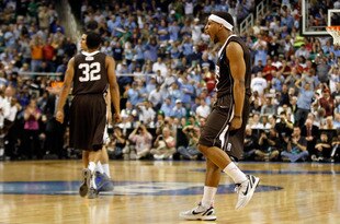 GREENSBORO, NC - MARCH 16:  (R) Mackey McKnight #11 of the Lehigh Mountain Hawks reacts late in the second half before the Mountain Hawks defeat the Duke Blue Devils 75-70 during the second round of the 2012 NCAA Men's Basketball Tournament at Greensboro Coliseum on March 16, 2012 in Greensboro, North Carolina.  (Photo by Streeter Lecka/Getty Images)