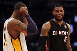 LOS ANGELES, CA - MARCH 04:  LeBron James #6 of the Miami Heat and Kobe Bryant #24 of the Los Angeles Lakers talk before an inbound at Staples Center on March 4, 2012 in Los Angeles, California.  NOTE TO USER: User expressly acknowledges and agrees that, by downloading and or using this photograph, User is consenting to the terms and conditions of the Getty Images License Agreement.  (Photo by Harry How/Getty Images)