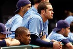 ST. PETERSBURG - OCTOBER 04:  Outfielder B.J. Upton (L) and infielder Evan Longoria #3 of the Tampa Bay Rays watch their team against the Texas Rangers during Game Four of the American League Division Series at Tropicana Field on October 4, 2011 in St. Petersburg, Florida.  (Photo by J. Meric/Getty Images)