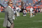 DENVER, CO - SEPTEMBER 18:  John Elway, Executive Vice President of Football Operations for the Denver Broncos, looks on from the bench as the Broncos warm up prior to facing the Cincinnati Bengals at Invesco Field at Mile High on September 18, 2011 in Denver, Colorado. The Broncos defeated the Bengals 24-22.  (Photo by Doug Pensinger/Getty Images)