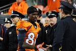 DENVER, CO - SEPTEMBER 12:  Brandon Lloyd #84 of the Denver Broncos greets Police Officers prior to the game against the Oakland Raiders at Sports Authority Field at Mile High on September 12, 2011 in Denver, Colorado.  (Photo by Garrett W. Ellwood/Getty Images)