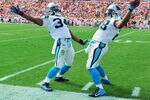 TAMPA, FL - DECEMBER 4:  Running backs Jonathan Stewart #28 and DeAngelo Williams #34 of the Carolina Panthers celebrate a touchdown run against the Tampa Bay Buccaneers December 4, 2011 at Raymond James Stadium in Tampa, Florida. (Photo by Al Messerschmidt/Getty Images)
