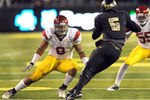 EUGENE, OR - NOVEMBER 19: Defensive end Nick Perry #8 and linebacker Lamar Dawson #55 of the USC Trojans close in on quarterback Darron Thomas #5 of the Oregon Ducksin the third quarter of the game at Autzen Stadium on November 19, 2011 in Eugene, Oregon. USC won the game 38-35. (Photo by Steve Dykes/Getty Images)