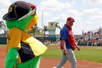 BRADENTON, FL - MARCH 16:  The Parrot, mascot of the Pittsburgh Pirates, mocks manager Charlie Manuel #41 of the Philadelphia Phillies just prior to the start of the Grapefruit League Spring Training Game at McKechnie Field on March 16, 2011 in Bradenton, Florida.  (Photo by J. Meric/Getty Images)