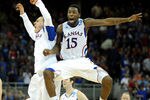 OMAHA, NE - MARCH 18:  Elijah Johnson #15 of the Kansas Jayhawks celebrates with teammates after they won 63-60 against the Purdue Boilermakers during the third round of the 2012 NCAA Men's Basketball Tournament at CenturyLink Center on March 18, 2012 in Omaha, Nebraska.  (Photo by Eric Francis/Getty Images)