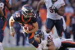 DENVER, CO - DECEMBER 11: Tim Tebow #15 of the Denver Broncos is tackled by Chris Conte #47 of the Chicago Bears after getting a first down at Sports Authority Field at Mile High on December 11, 2011 in Denver, Colorado.  (Photo by Doug Pensinger/Getty Images)