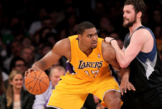 LOS ANGELES, CA - MARCH 16:  Andrew Bynum #17 of the Los Angeles Lakers controls the ball against Kevin Love #42 of the Minnesota Timberwolves at Staples Center on March 16, 2012 in Los Angeles, California.  The Lakers won 97-92.  NOTE TO USER: User expressly acknowledges and agrees that, by downloading and or using this photograph, User is consenting to the terms and conditions of the Getty Images License Agreement.  (Photo by Stephen Dunn/Getty Images)