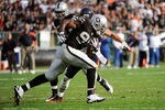 OAKLAND, CA - NOVEMBER 27:  Kamerion Wimbley #96 of the Oakland Raiders returns an interception seventy four yards against the Chicago Bears at O.co Coliseum on November 27, 2011 in Oakland, California.  (Photo by Thearon W. Henderson/Getty Images)