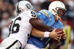 SAN DIEGO, CA - DECEMBER 5:  Quarterback Philip Rivers #17 of the San Diego Chargers is sacked by Kamerion Wimbley #96 of the Oakland Raiders during their NFL game at Qualcomm Stadium on December 5, 2010 in San Diego, California. (Photo by Donald Miralle/Getty Images)