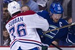 VANCOUVER, CANADA - MARCH 10: P.K. Subban #76 of the Montreal Canadiens delivers a bodycheck to Henrik Sedin #33 of the Vancouver Canucks during the first period in NHL action on March 10, 2012 at Rogers Arena in Vancouver, British Columbia, Canada.  (Photo by Rich Lam/Getty Images)