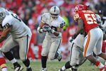 KANSAS CITY, MO - DECEMBER 24:  Running back Michael Bush #29 of the Oakland Raiders rushes up field against the Kansas City Chiefs during overtime on December 24, 2011 at Arrowhead Stadium in Kansas City, Missouri.  Oakland defeated Kansas City 16-13 in overtime.  (Photo by Peter Aiken/Getty Images)
