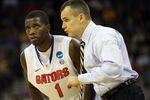 OMAHA, NE - MARCH 16:  Head coach Billy Donovan of the Florida Gators talks with Kenny Boynton #1 against the Virginia Cavaliers during the second round of the 2012 NCAA Men's Basketball Tournament at CenturyLink Center on March 16, 2012 in Omaha, Nebraska.  (Photo by Doug Pensinger/Getty Images)
