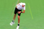 INDIAN WELLS, CA - MARCH 18:  John Isner serves during a 7-6(7), 6-3 loss to Roger Federer of Switzerland during the ATP Singles Final at the Indian Wells Tennis Garden on March 18, 2012 in Indian Wells, California.  (Photo by Harry How/Getty Images)