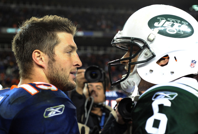 DENVER, CO - NOVEMBER 17: Tim Tebow #15 of the Denver Broncos talks with Mark Sanchez #6 of the New York Jets following the game at Sports Authority Field at Mile High on November 17, 2011 in Denver, Colorado.  (Photo by Garrett W. Ellwood/Getty Images)