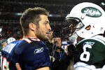 DENVER, CO - NOVEMBER 17: Tim Tebow #15 of the Denver Broncos talks with Mark Sanchez #6 of the New York Jets following the game at Sports Authority Field at Mile High on November 17, 2011 in Denver, Colorado.  (Photo by Garrett W. Ellwood/Getty Images)
