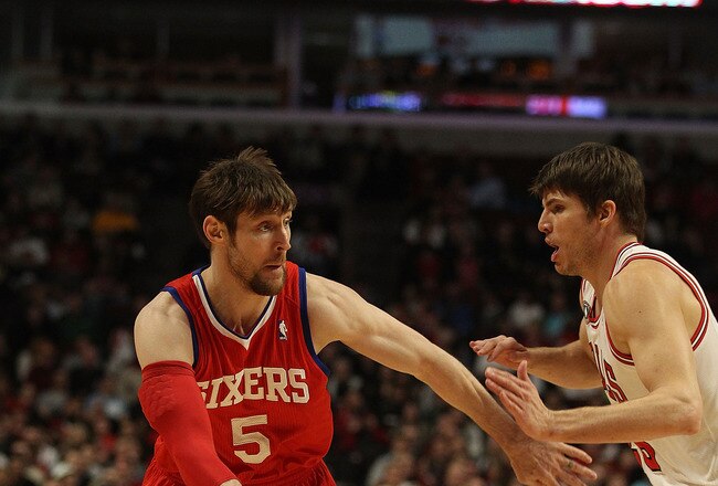 CHICAGO, IL - DECEMBER 21: Andres Nocioni #5 of the Philadelphia 76ers passes the ball around Kyle Korver #26 of the Chicago Bulls at the United Center on December 21, 2010 in Chicago, Illinois. The Bulls defeated the 76ers 121-76. NOTE TO USER: User expressly acknowledges and agrees that, by downloading and/or using this photograph, User is consenting to the terms and conditions of the Getty Images License Agreement.  (Photo by Jonathan Daniel/Getty Images)