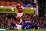 LIVERPOOL, ENGLAND - MARCH 21:  Arsenal player Aaron Ramsey skips through the Everton defence  during the Barclays Premier League match between Everton v Arsenal at Goodison Park on March 21, 2012 in Liverpool, England.  (Photo by Stu Forster/Getty Images)