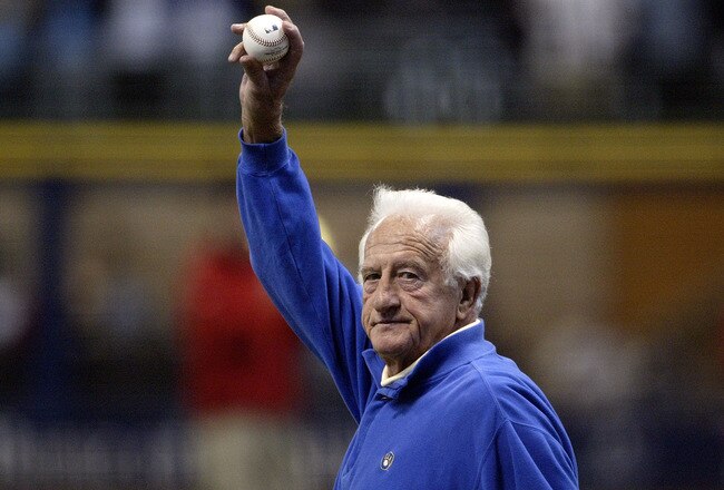 MILWAUKEE - OCTOBER 04:  Former major league baseball player Bob Uecker waves to the fans as he walks out to mound to throw out the ceremonial first pitch prior to the Milwaukee Brewers playing against the Philadelphia Phillies in Game three of the NLDS during the 2008 MLB playoffs at Miller Park on October 4, 2008 in Milwaukee, Wisconsin.  (Photo by Ben Smidt/Pool-Getty Images)