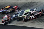 BRISTOL, TN - MARCH 18:  Carl Edwards, driver of the #99 Cheez-It Ford, Kasey Kahne, driver of the #5 Farmers Insurance Chevrolet, Marcos Ambrose, driver of the #9 Mac Tools Ford, Kyle Busch, driver of the #18 Wrigley Toyota, and Kevin Harvick, driver of the #29 Budweiser Chevrolet, are involved in an incident during the NASCAR Sprint Cup Series Food City 500 at Bristol Motor Speedway on March 18, 2012 in Bristol, Tennessee.  (Photo by Jared C. Tilton/Getty Images)