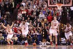 PORTLAND, OR - MARCH 17:   Will Sheehey #10, Christian Watford #2, Cody Zeller #40 and Remy Abell #23 of the Indiana Hoosiers celebrate along with their teammates after the Hoosiers defeated the Virginia Commonwealth Rams 63-61 during the third round of the 2012 NCAA Men's Basketball Tournament at the Rose Garden Arena on March 17, 2012 in Portland, Oregon.  (Photo by Jed Jacobsohn/Getty Images)