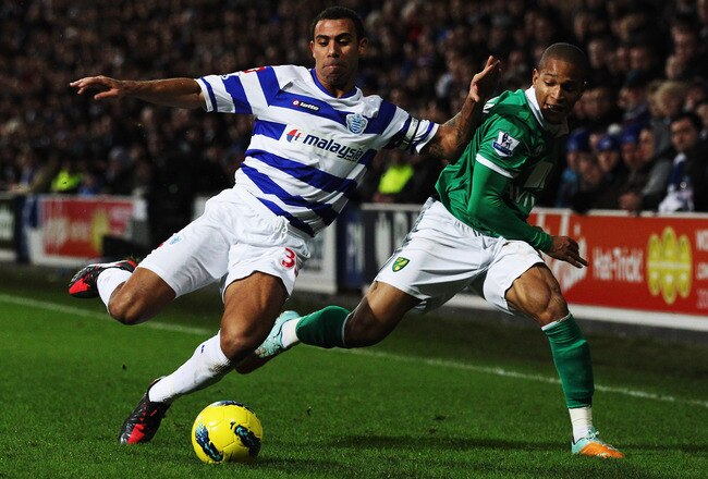 LONDON, ENGLAND - JANUARY 02:  Anton Ferdinand (L) of Queens Park Rangers and Simeon Jackson (R) of Norwich City challenge for the ball during the Barclays Premier League match between Queens Park Rangers and Norwich City at Loftus Road on January 2, 2012 in London, England.  (Photo by Scott Heavey/Getty Images)