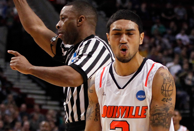 Louisville makes Michigan St. first No. 1 to fall in NCAA BASKETBALL
