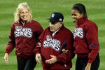 NEW YORK - OCTOBER 28:  New York Yankees legend and Baseball Hall of Famer Yogi Berra (C) walks on the field with First lady Michelle Obama (R) and Dr. Jill Biden, wife of Vice President Joe Biden, prior to Game One of the 2009 MLB World Series between the New York Yankees and the Philadelphia Phillies at Yankee Stadium on October 28, 2009 in the Bronx borough of New York City.  (Photo by Al Bello/Getty Images)