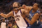 PHOENIX, AZ - MARCH 12:  Robin Lopez #15 of the Phoenix Suns battles for position with Derrick Williams #7 of the Minnesota Timberwolves during the NBA game at US Airways Center on March 12, 2012 in Phoenix, Arizona. The Timberwolves defeated the Suns 127-124.  NOTE TO USER: User expressly acknowledges and agrees that, by downloading and or using this photograph, User is consenting to the terms and conditions of the Getty Images License Agreement.  (Photo by Christian Petersen/Getty Images)