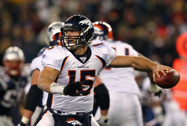 FOXBORO, MA - JANUARY 14:  Tim Tebow #15 of the Denver Broncos throws a pass against the New England Patriots during their AFC Divisional Playoff Game at Gillette Stadium on January 14, 2012 in Foxboro, Massachusetts.  (Photo by Al Bello/Getty Images)