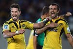 AUCKLAND, NEW ZEALAND - MARCH 23: Cory Jane and Conrad Smith of the Hurricanes celebrate winning the round five Super Rugby match between the Blues and the Hurricanes at Eden Park on March 23, 2012 in Auckland, New Zealand.  (Photo by Hannah Johnston/Getty Images)