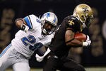 NEW ORLEANS, LA - DECEMBER 04:  Running back Maurice Morris #28 of the Detroit Lions looks to tackle cornerback Tracy Porter #22 of the New Orleans Saints after intercepting a pass in the fourth quarter at Mercedes-Benz Superdome on December 4, 2011 in New Orleans, Louisiana.  (Photo by Chris Graythen/Getty Images)