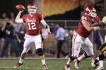TEMPE, AZ - DECEMBER 30:  Quarterback Landry Jones #12 of the Oklahoma Sooners throws a pass during the Insight Bowl against the Iowa Hawkeyes at Sun Devil Stadium on December 30, 2011 in Tempe, Arizona.  (Photo by Christian Petersen/Getty Images)
