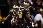 NEW ORLEANS, LA - DECEMBER 04:  Cornerback Tracy Porter #22 of the New Orleans Saints celebrates with teammates strong safety Roman Harper #41 and cornerback Jabari Greer #33 after an interception of quarterback Matthew Stafford #9 of the Detroit Lions in the fourth quarter at Mercedes-Benz Superdome on December 4, 2011 in New Orleans, Louisiana.  (Photo by Chris Graythen/Getty Images)