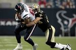 HOUSTON - AUGUST 22:  Tight end Joel Dreesen #85 o the Houston Texans is tackled by linebacker Troy Evans #54 of the New Orleans Saints on August 22, 2009 in Houston, Texas.  (Photo by Bob Levey/Getty Images)