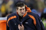 FOXBORO, MA - JANUARY 14:  Tim Tebow #15 of the Denver Broncos looks on against the New England Patriots during their AFC Divisional Playoff Game at Gillette Stadium on January 14, 2012 in Foxboro, Massachusetts.  (Photo by Jim Rogash/Getty Images)