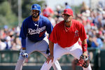 TEMPE, AZ - MARCH 12:  Matt Kemp #27 of the Los Angeles Dodgers leads off first base behind Albert Pujols #5 of the Los Angeles Angels of Anaheim in the second inning of a spring training baseball game at Tempe Diablo Stadium on March 12, 2012 in Tempe, Arizona.  (Photo by Kevork Djansezian/Getty Images)