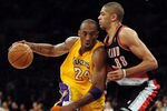 LOS ANGELES, CA - FEBRUARY 20:  Kobe Bryant #24 of the Los Angeles Lakers drives to the basket on Nicolas Batum #88 of the Portland Trail Blazers during the game at Staples Center on February 20, 2012 in Los Angeles, California.  NOTE TO USER: User expressly acknowledges and agrees that, by downloading and or using this photograph, User is consenting to the terms and conditions of the Getty Images License Agreement.  (Photo by Harry How/Getty Images)