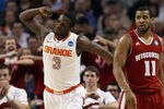 BOSTON, MA - MARCH 22:  Dion Waiters #3 of the Syracuse Orange reacts after a play as Jordan Taylor #11 of the Wisconsin Badgers looks on during their 2012 NCAA Men's Basketball East Regional Semifinal game at TD Garden on March 22, 2012 in Boston, Massachusetts.  (Photo by Elsa/Getty Images)