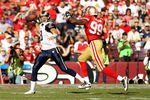 SAN FRANCISCO - NOVEMBER 14:  Sam Bradford #8  of the St. Louis Rams is chased by Manny Lawson #99 of the San Francisco 49ers at Candlestick Park on November 14, 2010 in San Francisco, California.  (Photo by Ezra Shaw/Getty Images)
