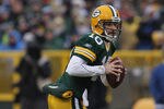 GREEN BAY, WI - JANUARY 01:  Matt Flynn #10 of the Green Bay Packers rolls out to look for a receiver against the Detroit Lions at Lambeau Field on January 1, 2012 in Green Bay, Wisconsin. The Packers defeated the Lions 45-41.  (Photo by Jonathan Daniel/Getty Images)