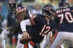 CHICAGO, IL - DECEMBER 18:  Caleb Hanie #12 of the Chicago Bears runs out of the pocket against the Seattle Seahawks at Soldier Field on December18, 2011 in Chicago, Illinois. The Seahawks defeated the Bears 38-14.  (Photo by Jonathan Daniel/Getty Images)