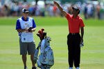 ORLANDO, FL - MARCH 25:  Tiger Woods of the USA waits to play his second shot at the par 4, first hole with his caddie Joe LaCava of the USA during the final round of the 2012 Arnold Palmer Invitational presented by MasterCard at Bay Hill Club and Lodge on March 25, 2012 in Orlando, Florida.  (Photo by David Cannon/Getty Images)
