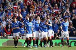 GLASGOW, SCOTLAND - MARCH 25:  Lee Wallace of Rangers celebrates with team-mates after scoring his team's third goal during the Clydesdale Bank Scottish Premier League match between Rangers and Celtic at Ibrox Stadium on March 25, 2012 in Glasgow, Scotland.  (Photo by Ian Walton/Getty Images)