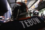 DENVER, CO - NOVEMBER 17:  Quarterback Tim Tebow #15 of the Denver Broncos prepares to take the field to face the New York Jets at Sports Authority Field at Mile High on November 17, 2011 in Denver, Colorado. The Broncos defeated the Jets 17-13.  (Photo by Doug Pensinger/Getty Images)