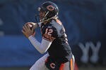 CHICAGO, IL - DECEMBER 18:  Caleb Hanie #12 of the Chicago Bears runs out of the pocket against the Seattle Seahawks at Soldier Field on December18, 2011 in Chicago, Illinois. The Seahawks defeated the Bears 38-14.  (Photo by Jonathan Daniel/Getty Images)